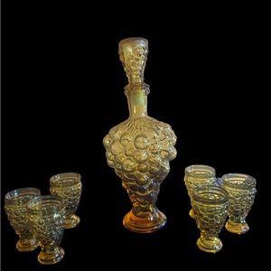 Vintage amber glass decanter and cup set UV reactive grape motif